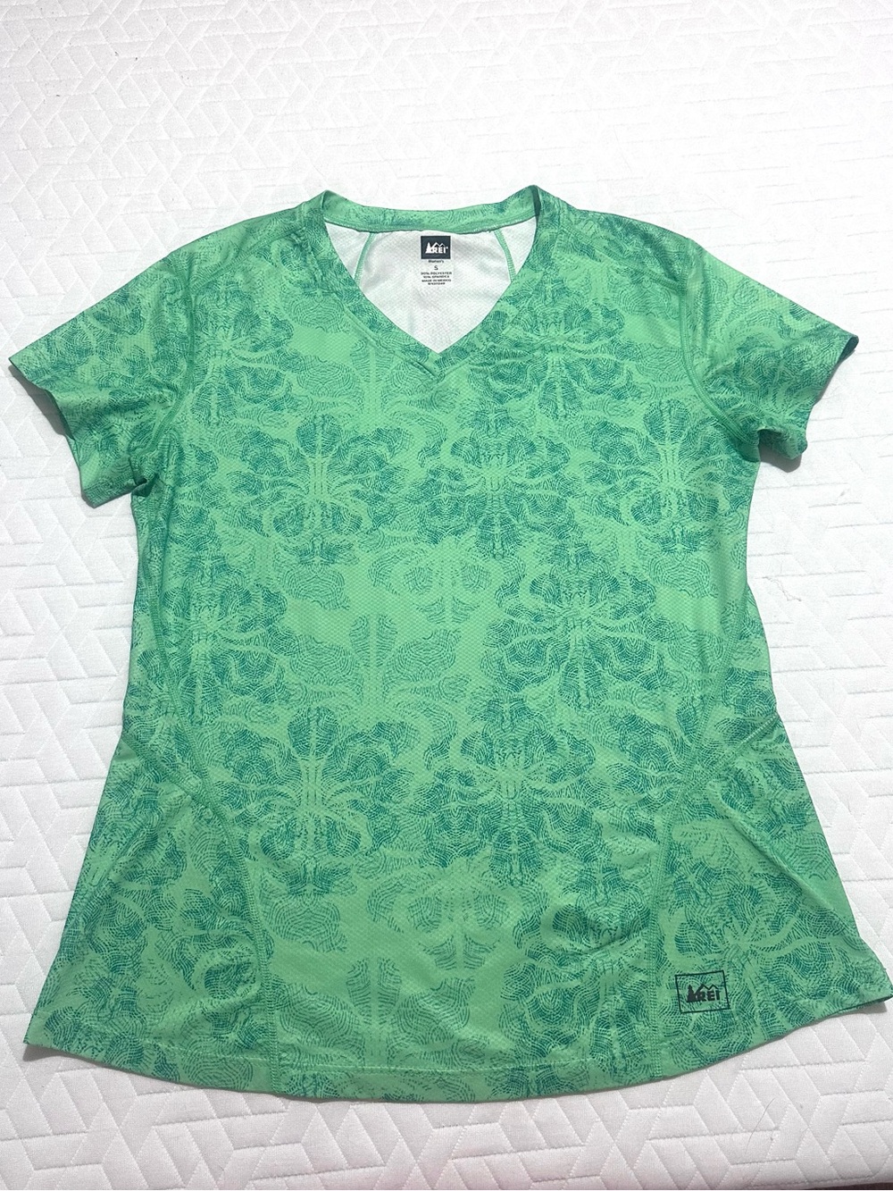 REI Women's Short Sleeve V-Neck Tee in Light Green with Darker Green Print